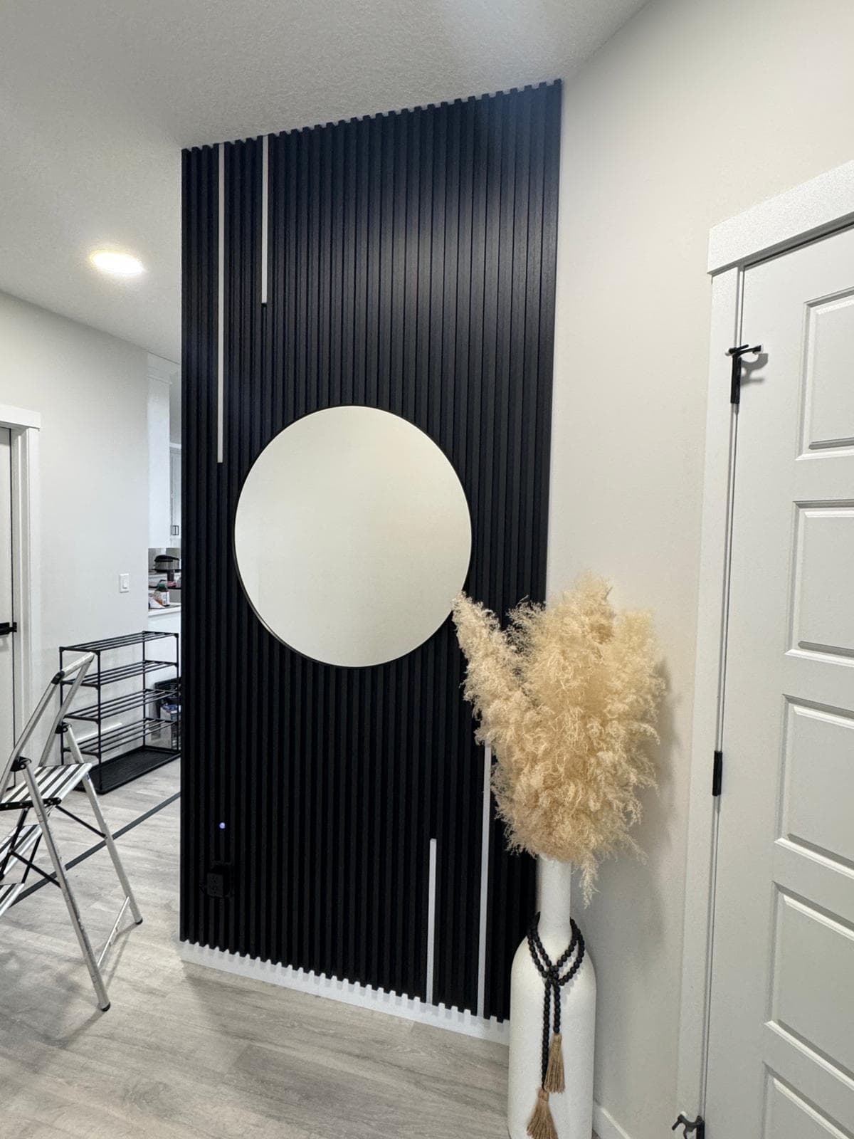 Office reception with slat panel and textured wallpaper